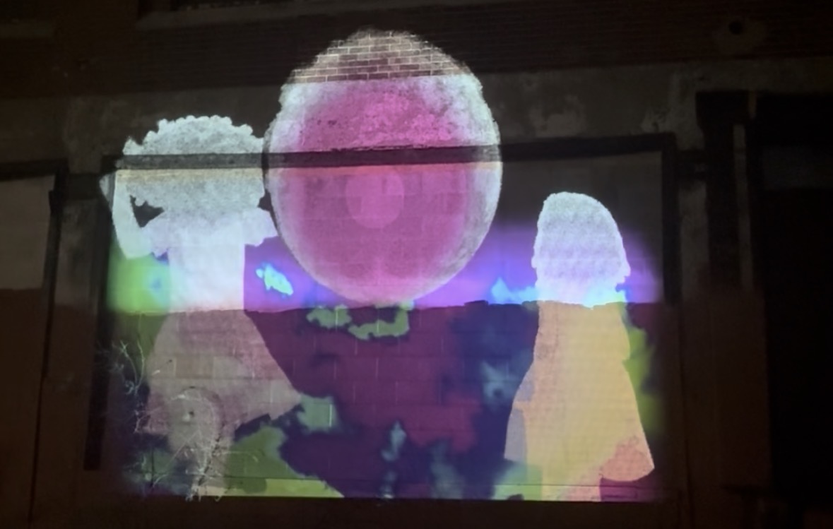 Projected figures and color on an architectural surface