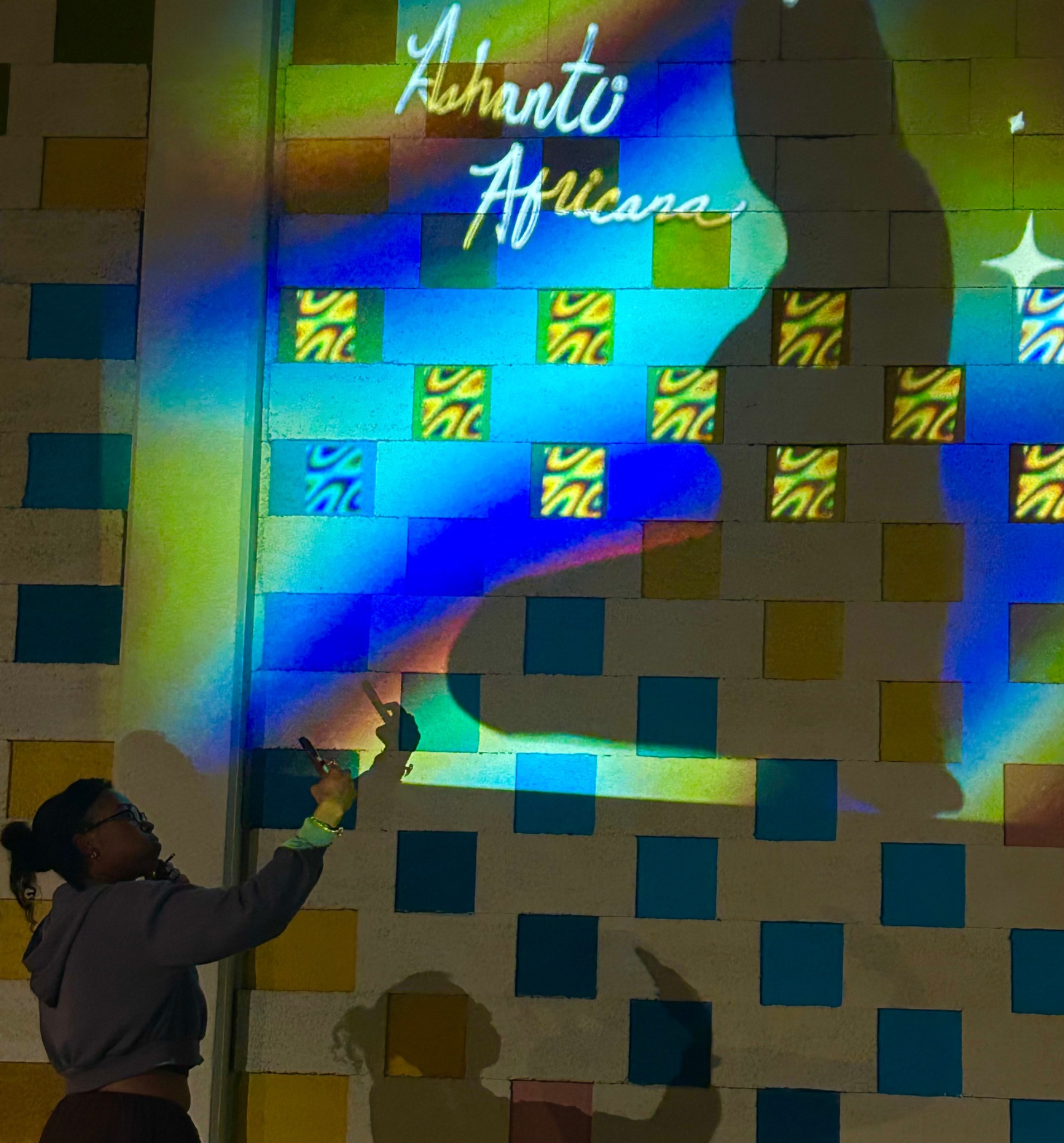 Interactive projection experience across a geometric wall surface